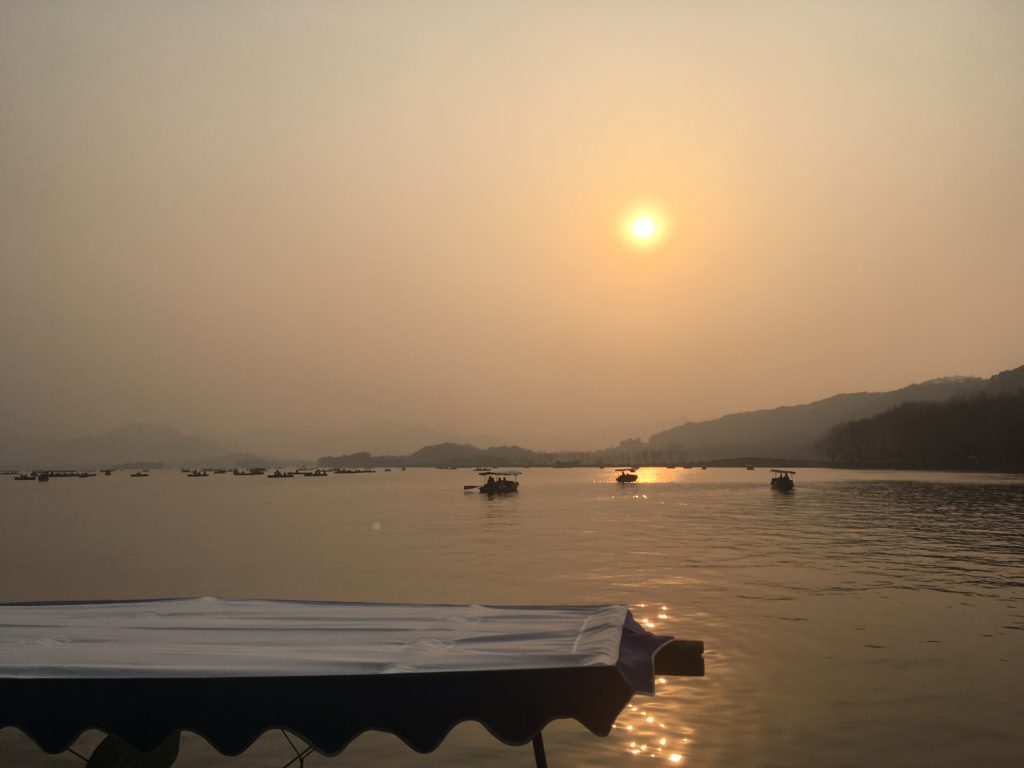 Sunset over West Lake, one of the most popular tourist attractions in China.