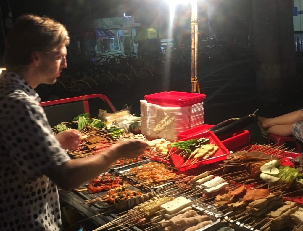 Westerner ordering Chinese street BBQ