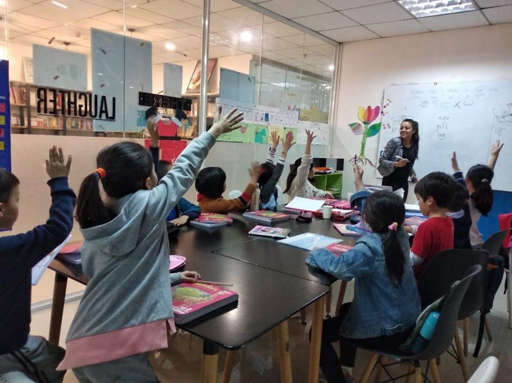 Busy happy TEFL teacher class at UP school Chengdu