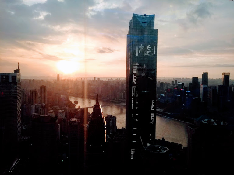 Chongqing cityscape view with a new high rise tower under construction in the center foreground
